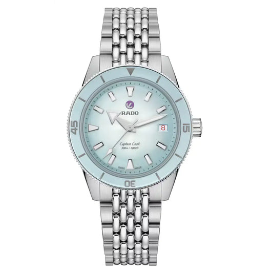 Silver watch with a light blue face on a white background r32223203 available at swiss paradise