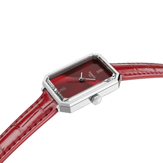 TISSOT SRV 30 MMWatch with red face and strap on a white background