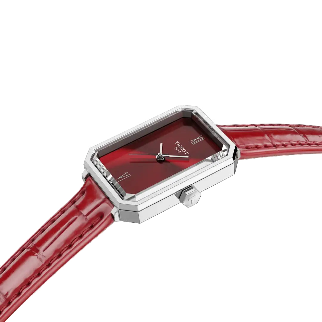 TISSOT SRV 30 MMWatch with red face and strap on a white background